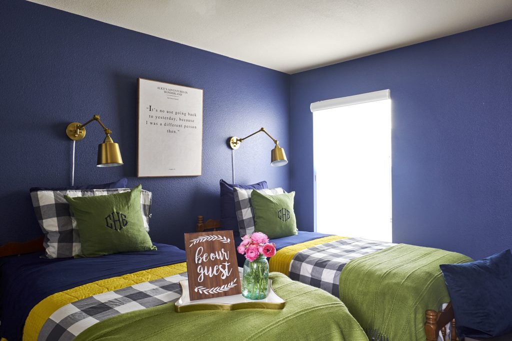 colorful bedroom with sconces
